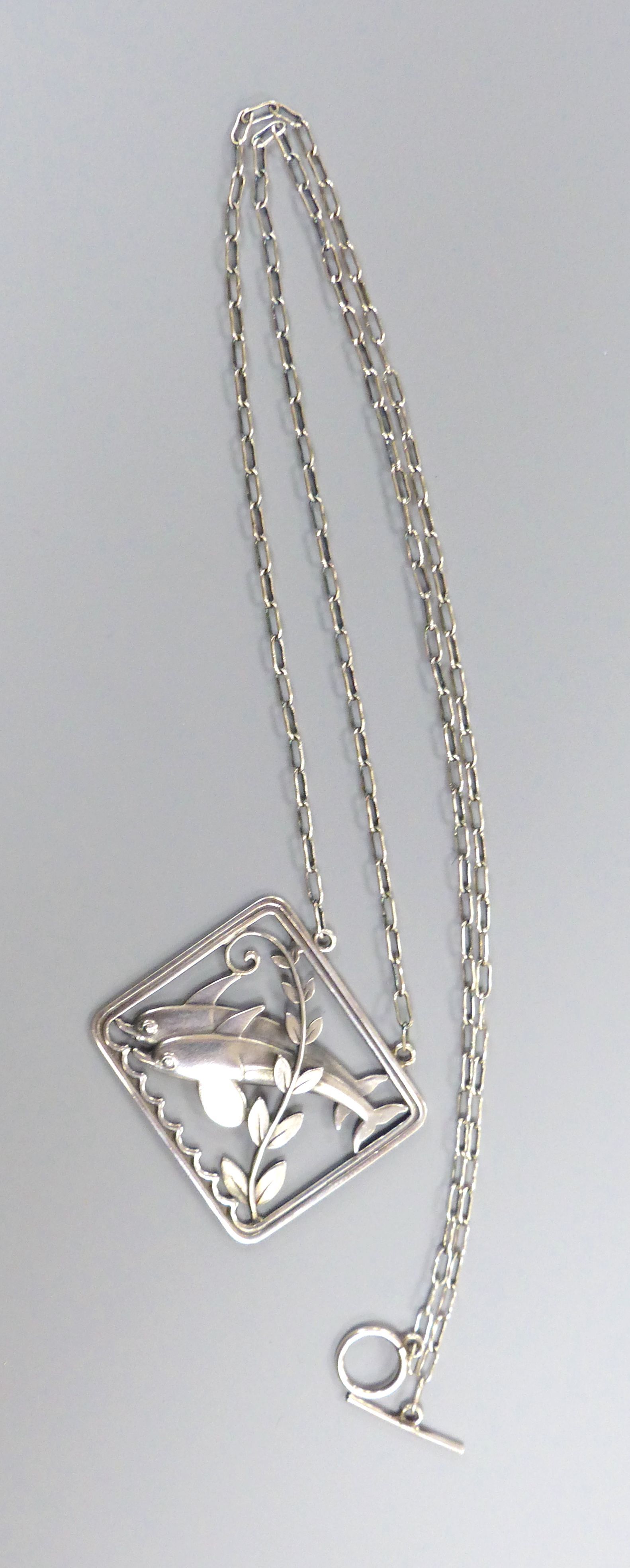 A Georg Jensen sterling twin leaping dolphin with frond rectangular pendant necklace, no. 94, pendant, 36mm, chain, 58cm.